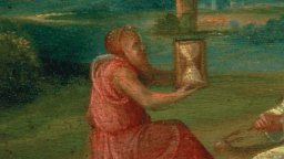A person in a red robe sits outdoors holding an hourglass, surrounded by greenery and a body of water, symbolizing predictions for the future.